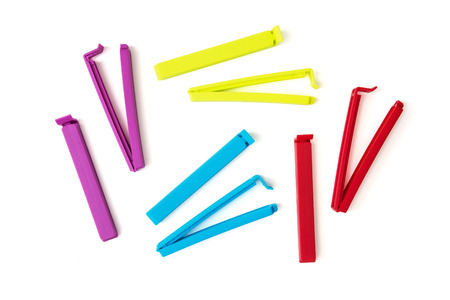 Various colorful bag clips isolated on the white background. Funny photo.の写真素材