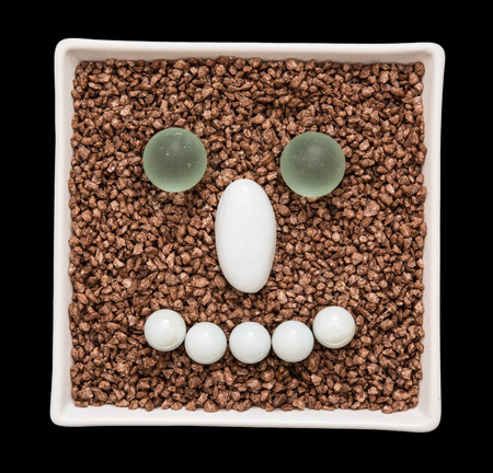 Decorative stones in the smile face shape. Humorous concept.の写真素材