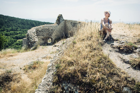 Young caucasian woman in a sailor outfit posing in Cachtice castle, Slovak republic. Travel destination.の写真素材