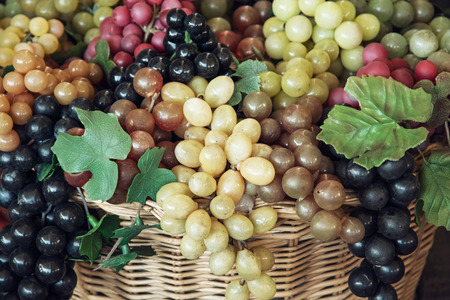 Mix of various grapes in wicker baskets.の写真素材