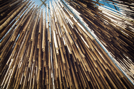 Bamboo decoration hanging from the ceiling. Architectural element.の写真素材