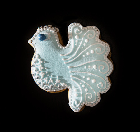 Tasty gingerbread dove on the dark background. Christmas theme.の写真素材