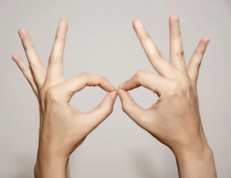 Woman's hands makes funny shapes. Beauty and fashion.の写真素材