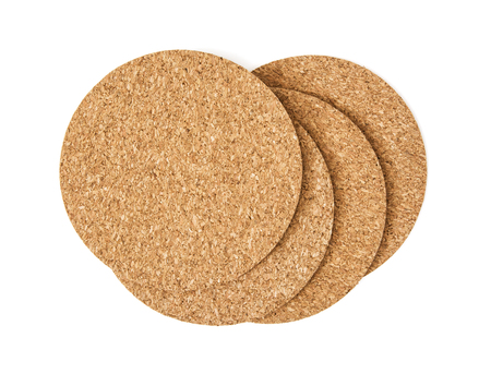 Cork drink coasters arranged on the white background.の写真素材