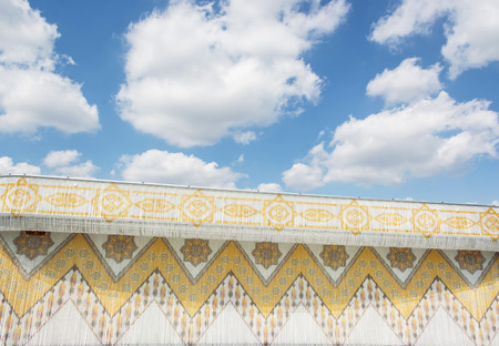Traditional arabic architecture and cloudy sky. Architectural element.の写真素材