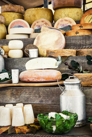 Dairy products and green lettuce on the wooden background.の写真素材