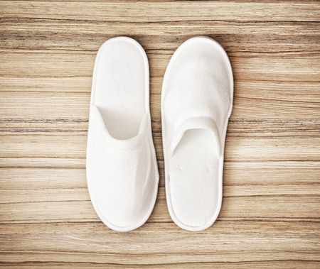 White slippers on the wooden background. Beauty and fashion. Retro style.の写真素材