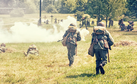 NITRA, SLOVAK REPUBLIC - MAY 21: Reconstruction of the Second World War operations Between Red and German army, german soldiers attacks the russian defense units on May 21, 2016 in Nitra, Slovak Republic.のeditorial素材