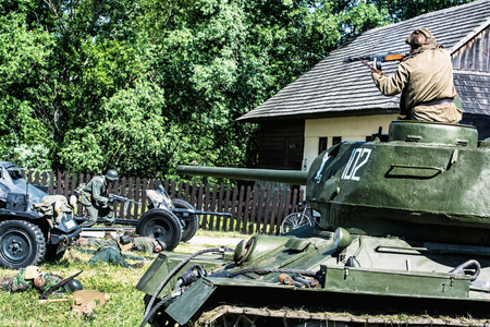 NITRA, SLOVAK REPUBLIC - MAY 21: Reconstruction of the Second World War operations Between Red and German army, russian trooper kills german soldiers on May 21, 2016 in Nitra, Slovak Republic.のeditorial素材