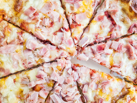 Baked tasty pizza with cheese and ham. Food theme. International cuisine. Lunch menu. Fast food.の写真素材