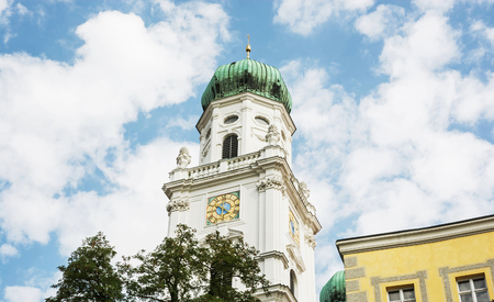Famous Saint Stephen's cathedral in Passau, Germany. Religious architecture. Clock tower. Cultural heritage.の写真素材