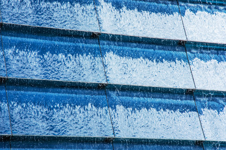 Blue water cascade background. Modern architecture detail. Abstract scene.