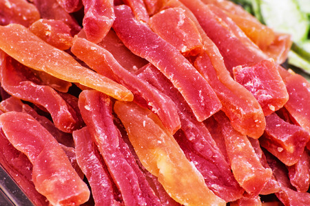 Dried sliced oranges and grapefruits on the market place. Citrus fruits. Healthy food theme.の写真素材