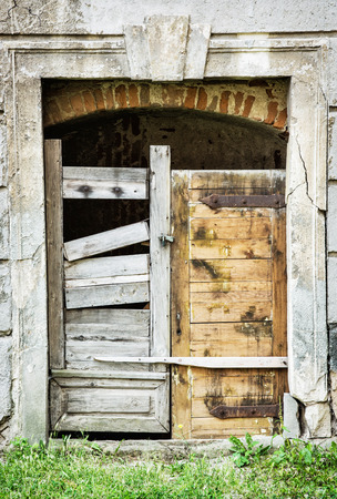 Ancient wooden door. Architectural element. Vertical composition.の写真素材