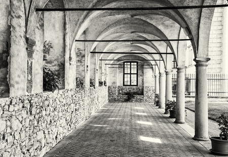 Medieval arcade corridor at Telc castle, Czech republic. Black and white photo. Architectural scene. Unesco World Heritage Site. Travel destination. Beautiful place.のeditorial素材
