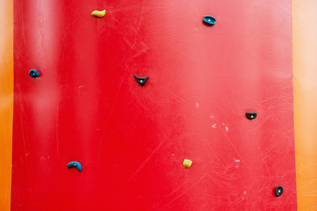 Red climbing wall. Adrenaline sport theme. Leisure activity.の写真素材