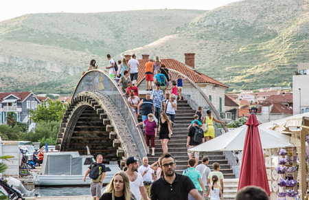 TROGIR, CROATIA â JULY 25, 2017: Many tourists are walking through the arched bridge in Trogir, Croatia, Unesco. Travel destination. Summer vacation. Illustrative editorial.のeditorial素材