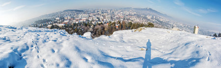 Snowy landscape with Nitra city, Slovak republic. Panoramic photo. Beautiful seasonal scene.
