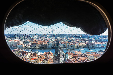 Charles bridge and Zizkov television tower from St. Nicholas bell tower, Prague. Travel destination. Architectural scene.の写真素材