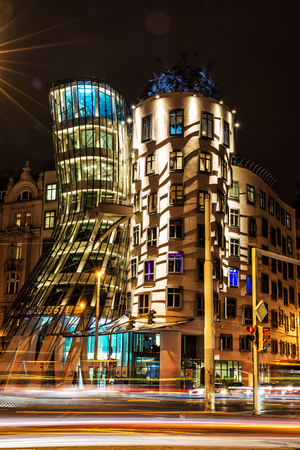 Dancing house with traffic in Prague, Czech republic. Modern architecture. Night scene. Travel destination. Vertical composition.のeditorial素材