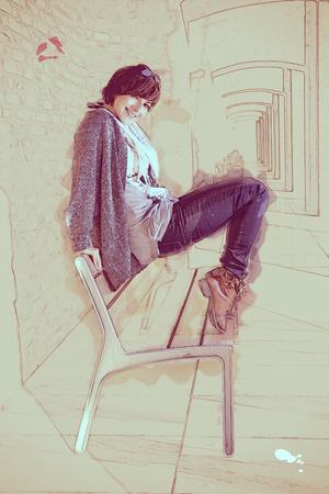 Beautiful caucasian brunette posing on a bench. Beautiful caucasian brunette posing on a bench.