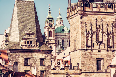Lesser town bridge tower and St. Nicholas Church, Prague, Czech republic. Red photo filter. Architectural scene.の写真素材