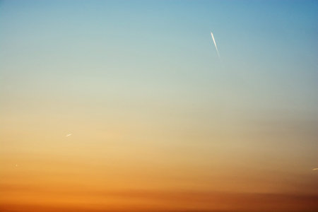 Sunset beautiful colorful twilight in pure sky with airplanes. Evening scene.