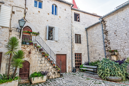 Courtyard of private house in old town Trogir, Croatia. Architectural theme. Travel destination.の写真素材