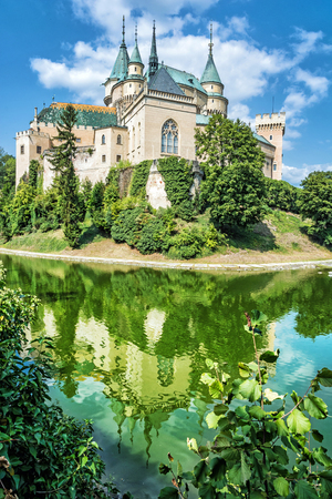Bojnice castle is mirrored in water, Slovak republic. Cultural heritage. Travel destination.のeditorial素材