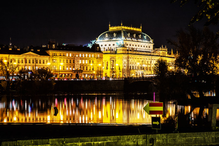 PRAGUE, CZECH REPUBLIC â OCTOBER 31, 2018: National theatre building and Vltava river, Prague, Czech republic. Night scene. Travel destination. Illustrative editorial. Cultural heritage.のeditorial素材