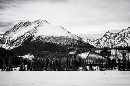 Solisko peak and hotel Patria in Strbske pleso, High Tatras, Slovak republic. Winter mountains. Travel destination. Black and white photo.のeditorial素材