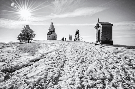 Calvary in Nitra city, Slovak republic. Religious place. Winter scene. Cultural heritage. Travel destination. Snow and sunny. Black and white photo.の写真素材
