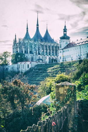 St. Barbara's Church and Jesuit College in Kutna Hora, Czech republic. Religious architecture. Travel destination. Analog photo filter with scratches.の写真素材