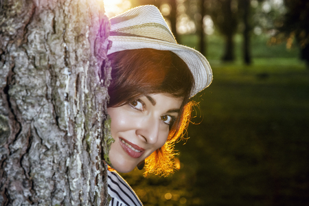 Young caucasian natural woman posing in sunny backlight. Sexy female portrait.の写真素材