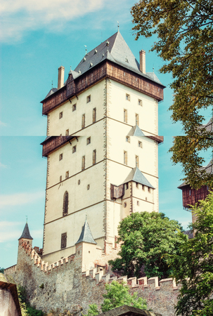 Karlstejn is a large gothic castle founded 1348 by Charles IV in Czech republic. Ancient architecture. Travel destination. Old photo filter.のeditorial素材