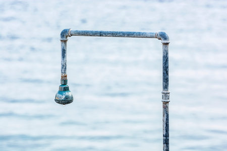Shower on the beach, Solta, Croatia. Summer vacation.