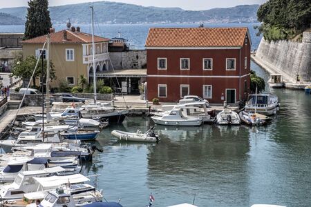 ZADAR, CROATIA â AUGUST 22, 2019: Many boats in the harbor and tourists, Zadar, Croatia, Europe. Summer vacation. Travel destination. Illustrative editorial.のeditorial素材