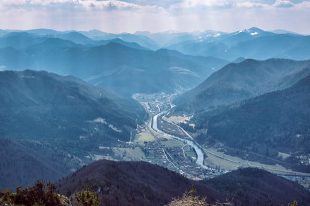 Big Fatra mountains and Stankovany village from Sip peak, Slovak republic. Seasonal natural scene....