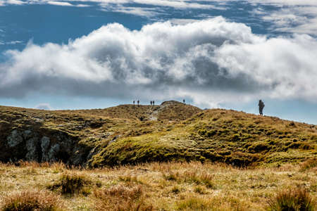 Tourists in Salatin peak, Western Tatras mountains, Slovak republic. Hiking theme. Seasonal natural scene.の写真素材
