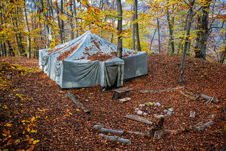 Old tent in the autumn forest, Strazov mountains, Slovak republic. Travel destination.の写真素材