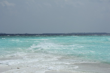 blue  waves on the sea in the Maldivesの写真素材