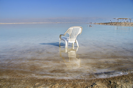 plastic chair in the water of the Dead Seaの写真素材