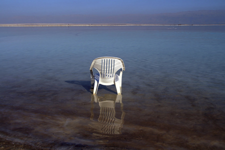 white plastic chair in the water of the Dead Seaの写真素材