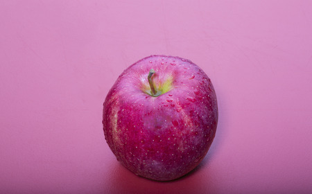 Washington Apple on a Red Backgroundの写真素材