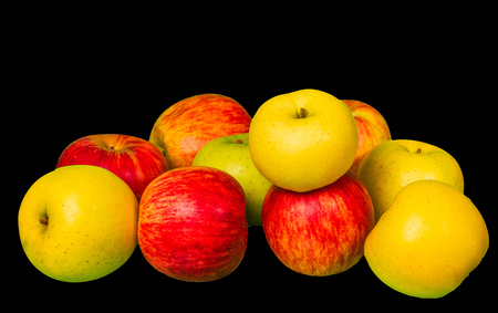 Pile of green and red apples on blackの写真素材