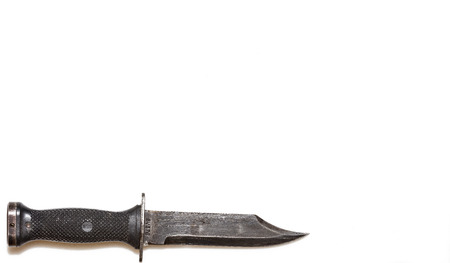 A well used U.S. Navy combat knife alongside its scabbard used by U.S. Navy SEALs and other Navy assault forces.の写真素材