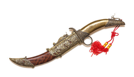 A ceremonial curved dagger in an ornate scabbard.
