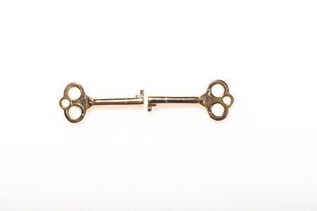 Two Skeleton keys opposing one another on a white backgroundの写真素材