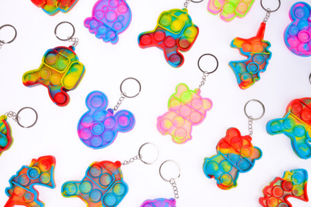 Pop it silicone rainbow anti-stress toy isolated on white background. Simple dimple, popular modern stress relief toys for adults and children. Fidget kid toy, Pop Bubble Fidget.の写真素材