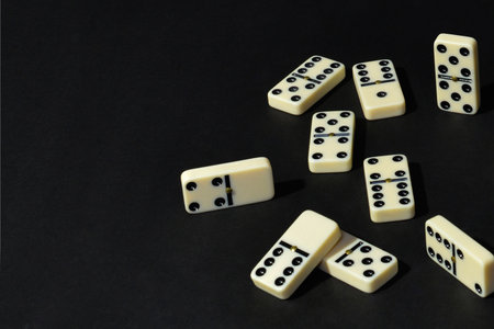 Dominoes on a black background. Top view, copy spaceの写真素材